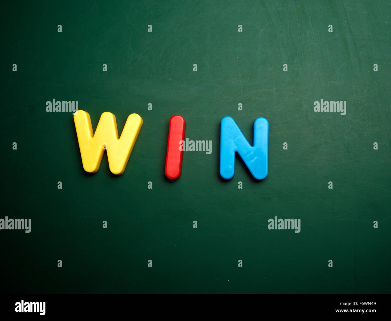 win concept in colorful letters isolated on blank blackboard Stock Photo