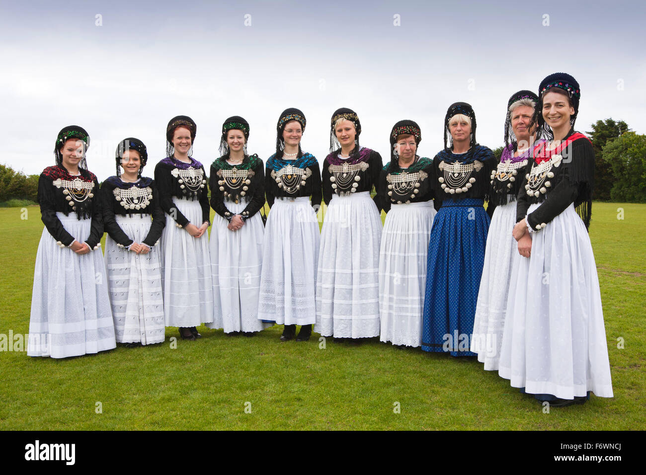 Women in traditional frisian costumes, Nebel, Amrum island, North Sea
