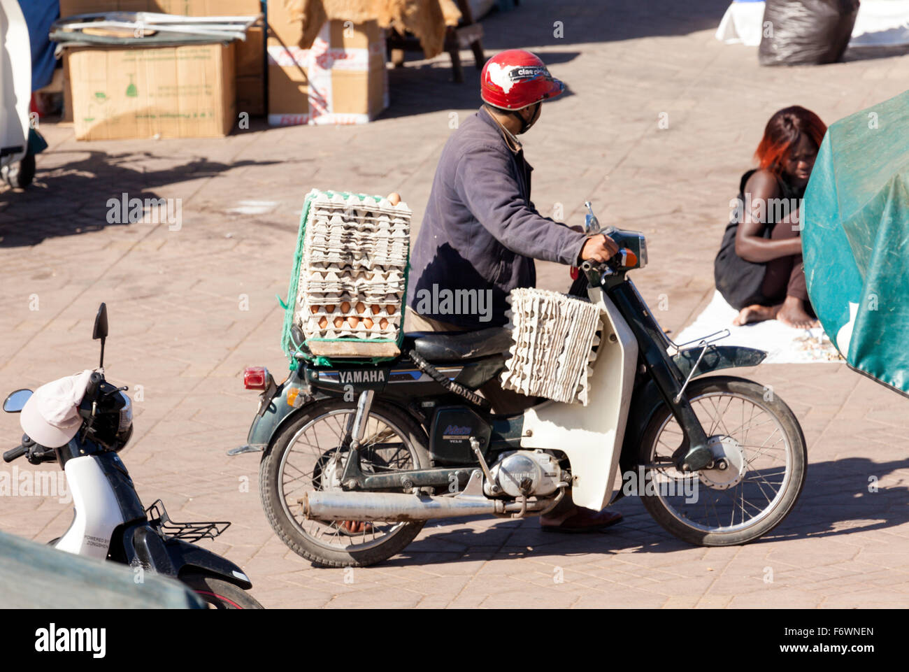 Egg supplier with motor scooter, Djemaa el Fna square, Marrakesh, Morocco Stock Photo