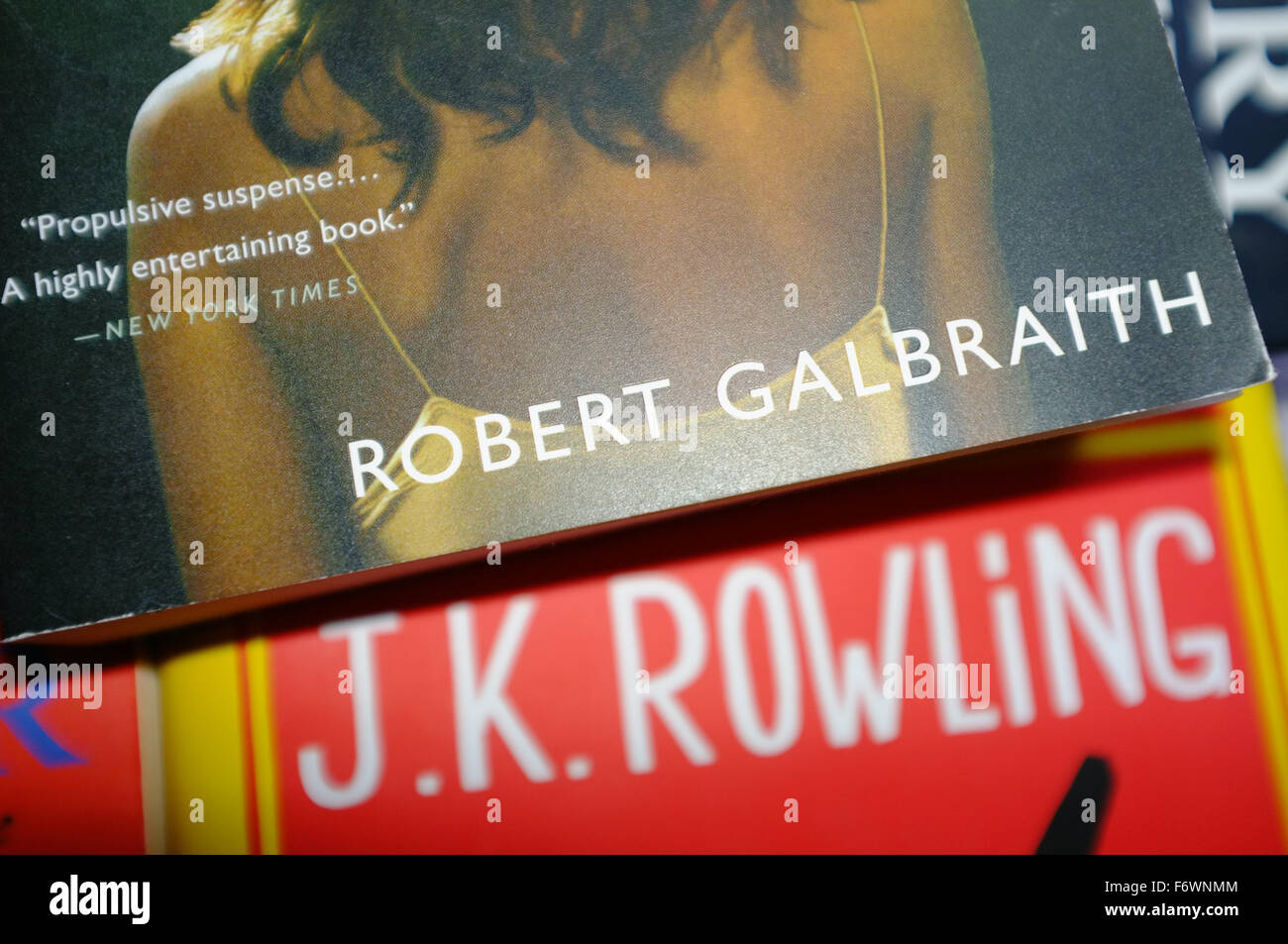 A Robert Galbraith book on top of a J.K. Rowling book. Stock Photo