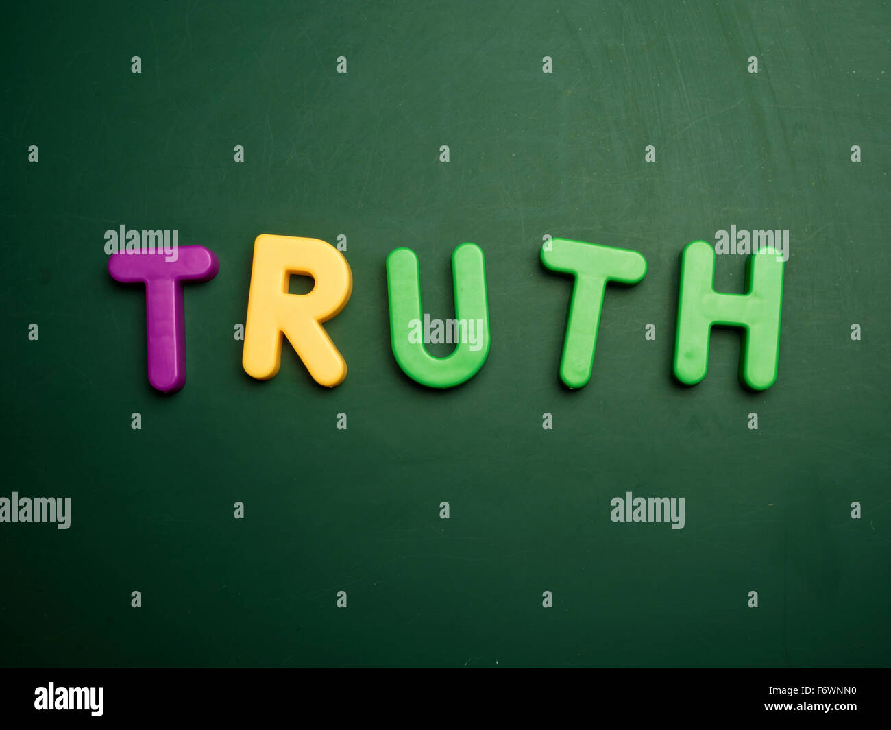 truth concept in colorful letters isolated on blank blackboard Stock Photo