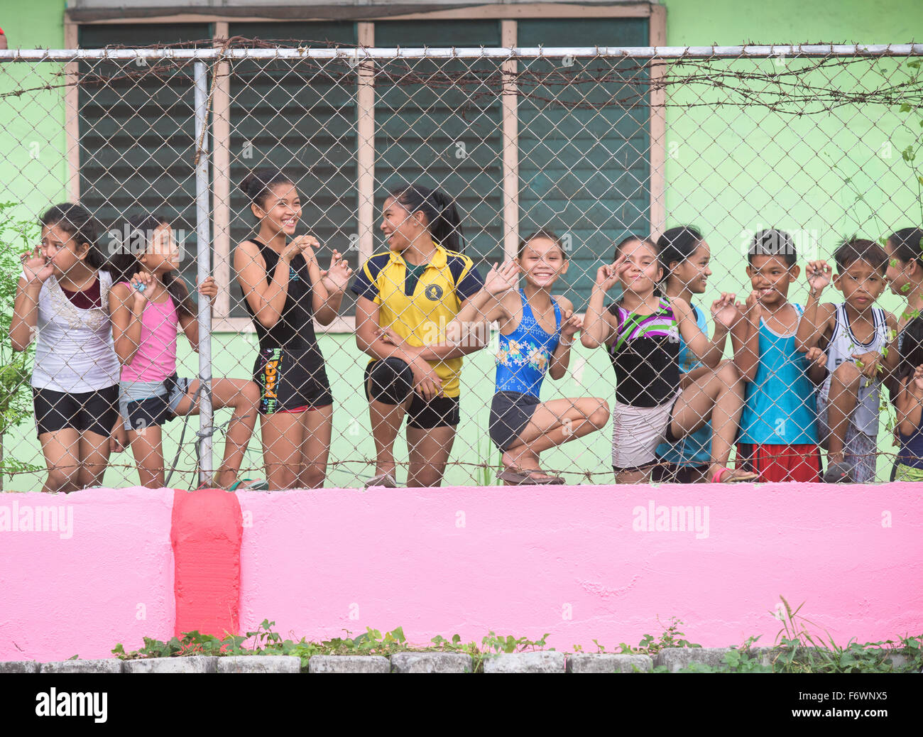 Students looking through the wire fence of Dadiangas South Central Elementary School in General Santos City Stock Photo