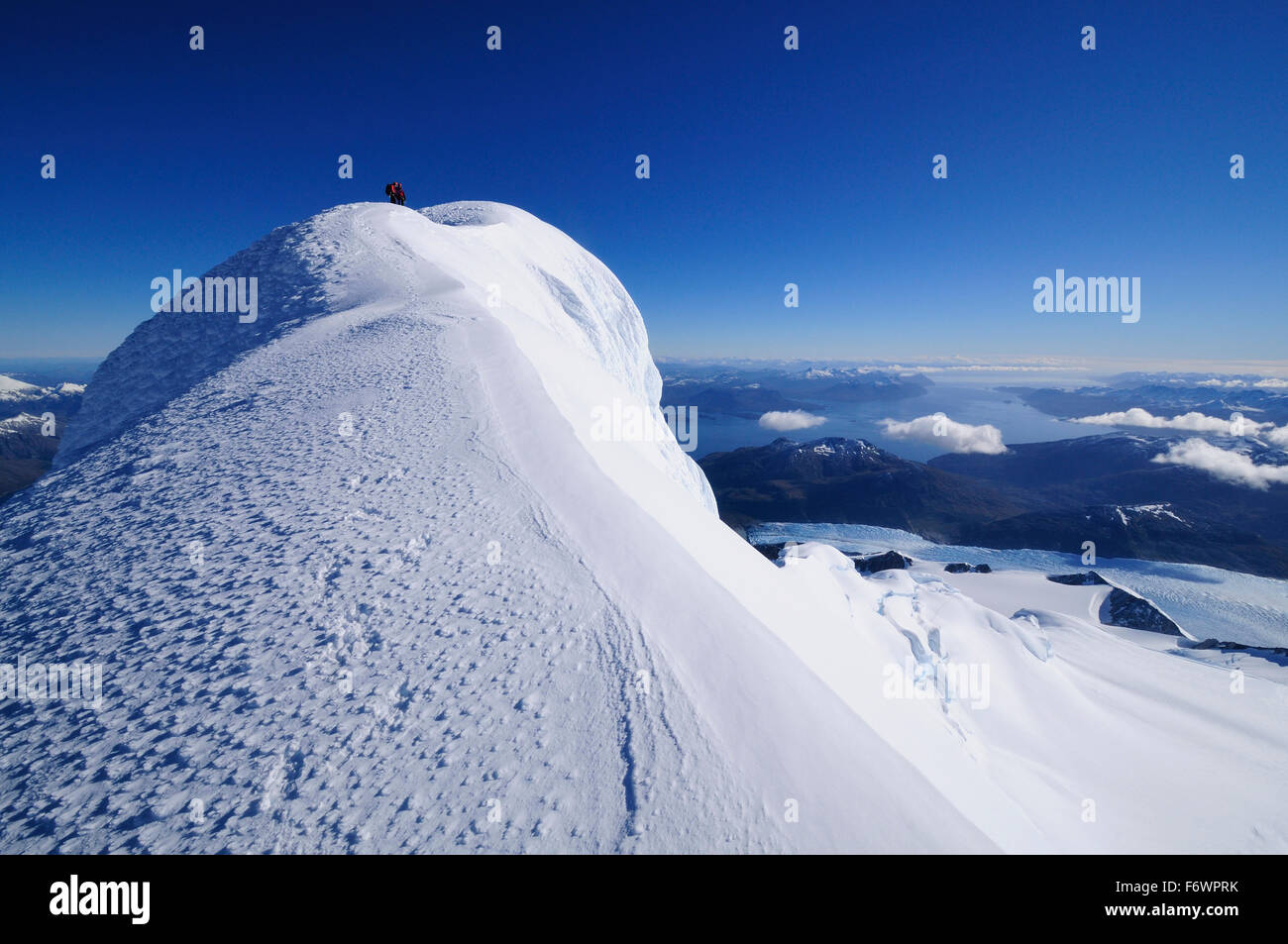 Two mountaineers on the west summit of Monte Sarmiento, Cordillera Darwin, Tierra del Fuego, Chile Stock Photo