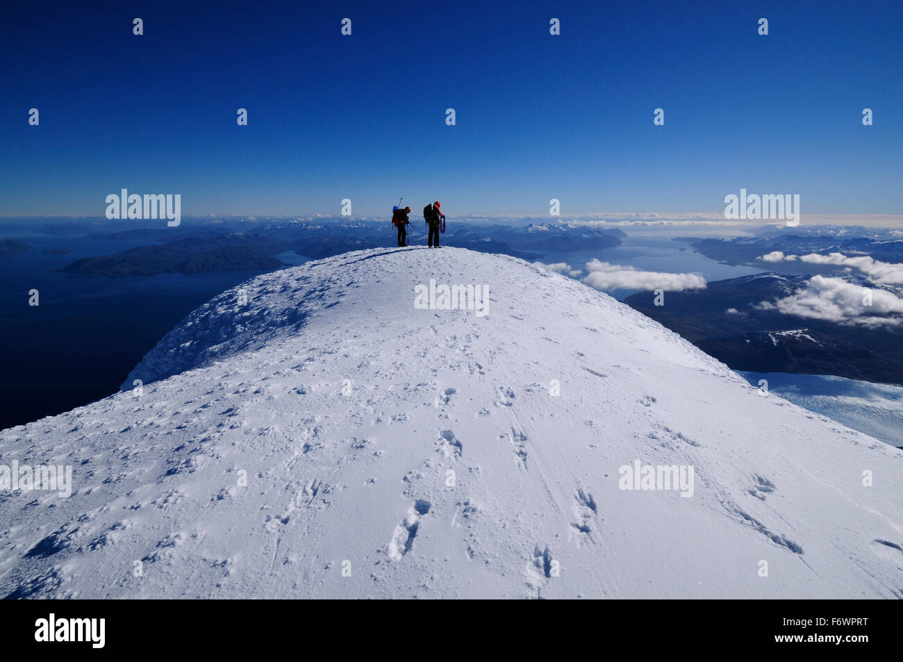 Two mountaineers at the west summit of Monte Sarmiento, Cordillera Darwin, Tierra del Fuego, Chile Stock Photo