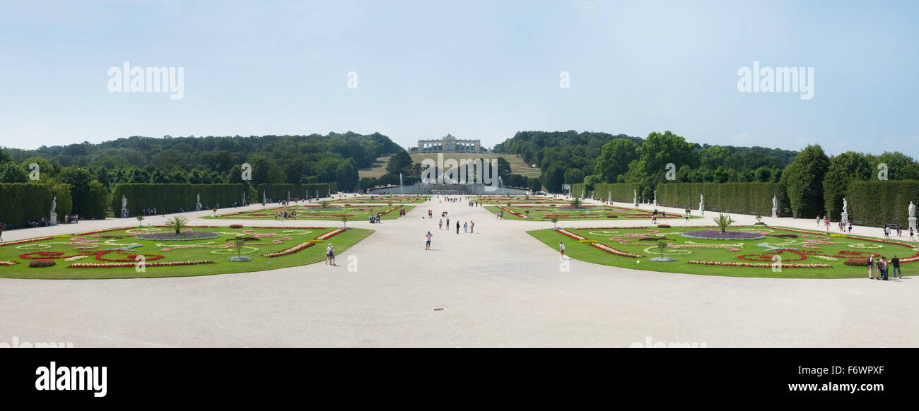 WIEN - AUGUST 3: People visiting giant garden of Schoenbrunn Sissi Castle. Since 1996 the palace and the garden have been declar Stock Photo