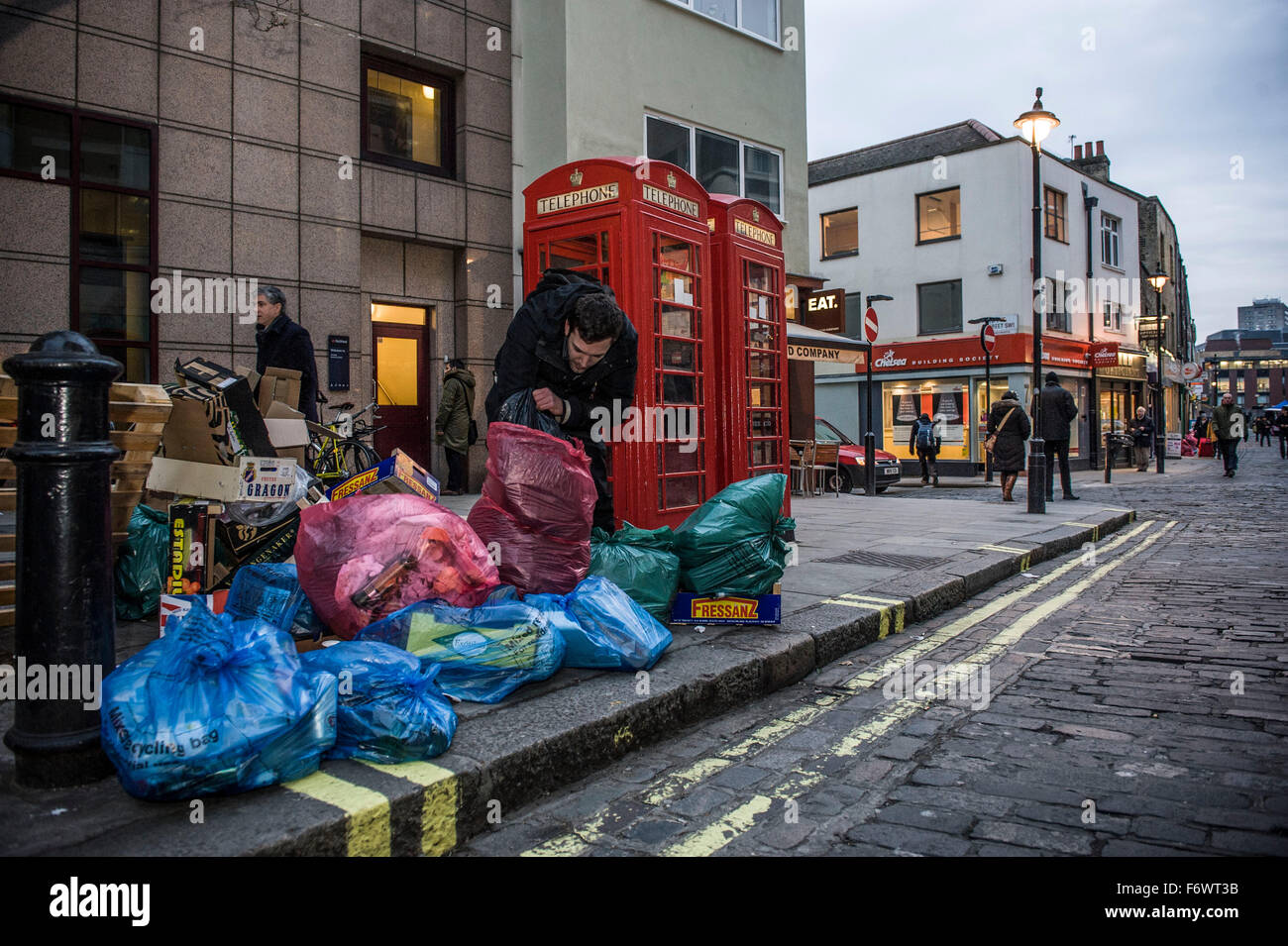 scavenging for edible food  waste , Stratton Ground , London Sw1 and Greggs Bakers off of Victoria St closely Stock Photo