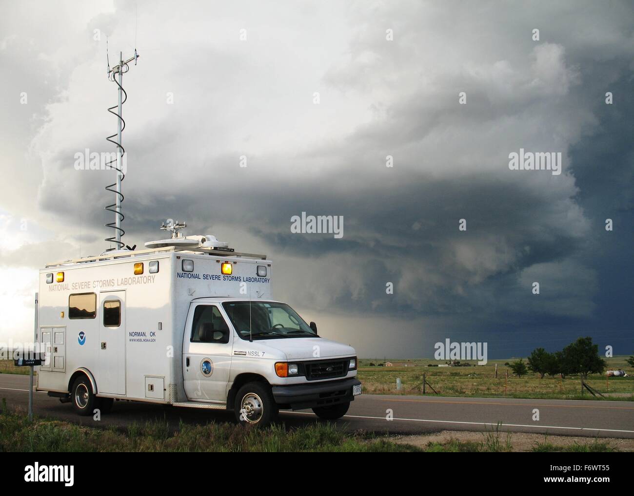 A VORTEX2 field command vehicle from the National Severe Storms Laboratory researches a tornado June 11, 2009 in Colorado. Stock Photo