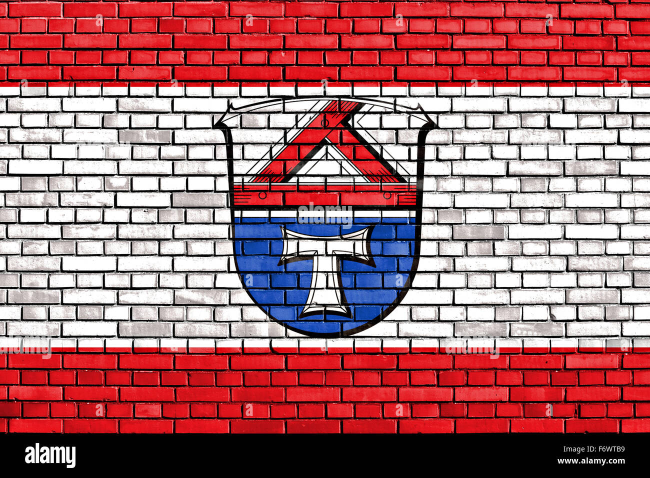 flag of Giessen painted on brick wall Stock Photo