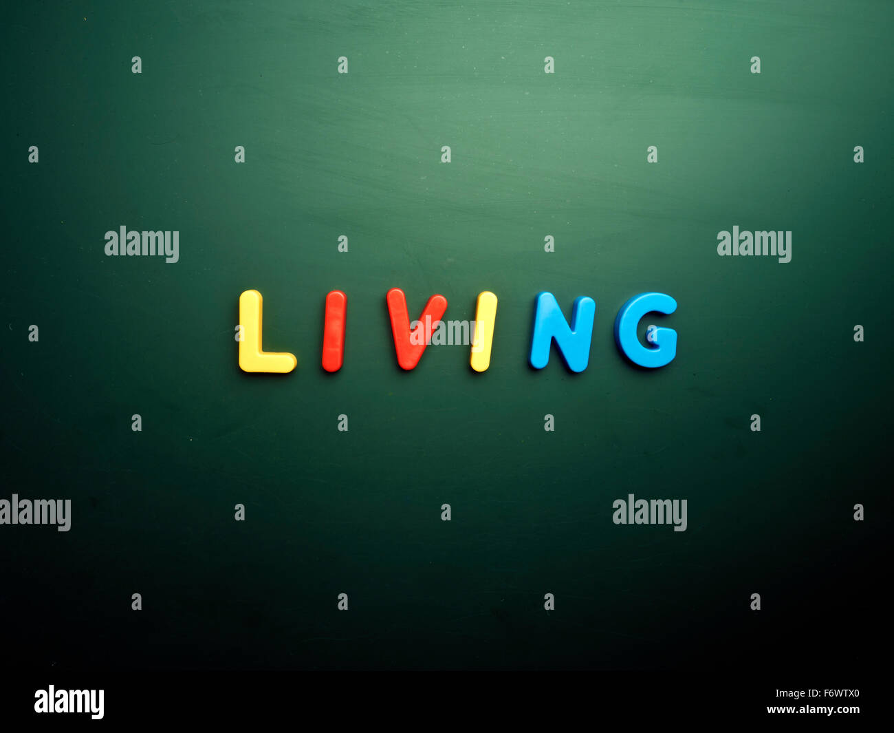 living concept in colorful letters isolated on blank blackboard Stock ...