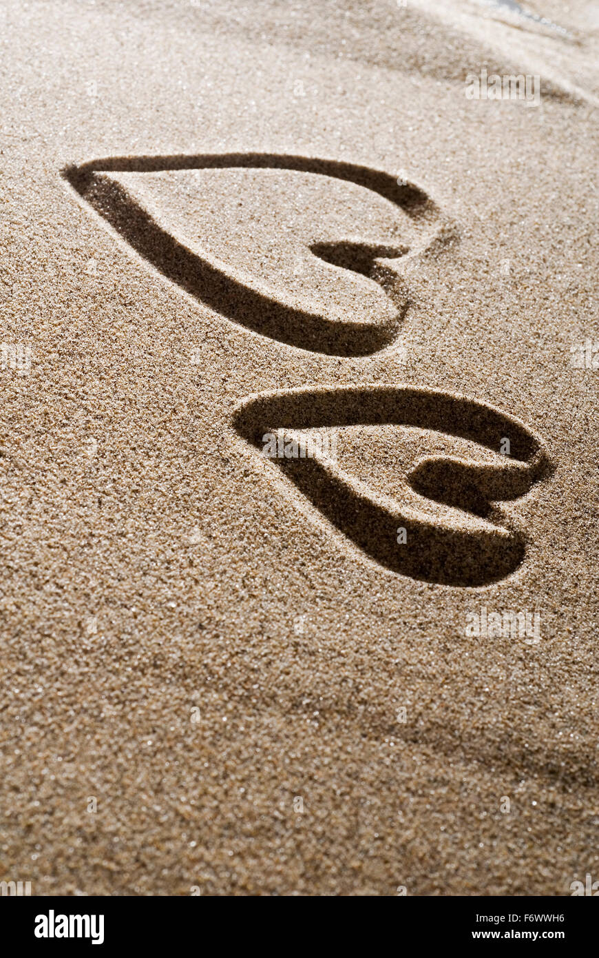 A heart painted in the sand Stock Photo