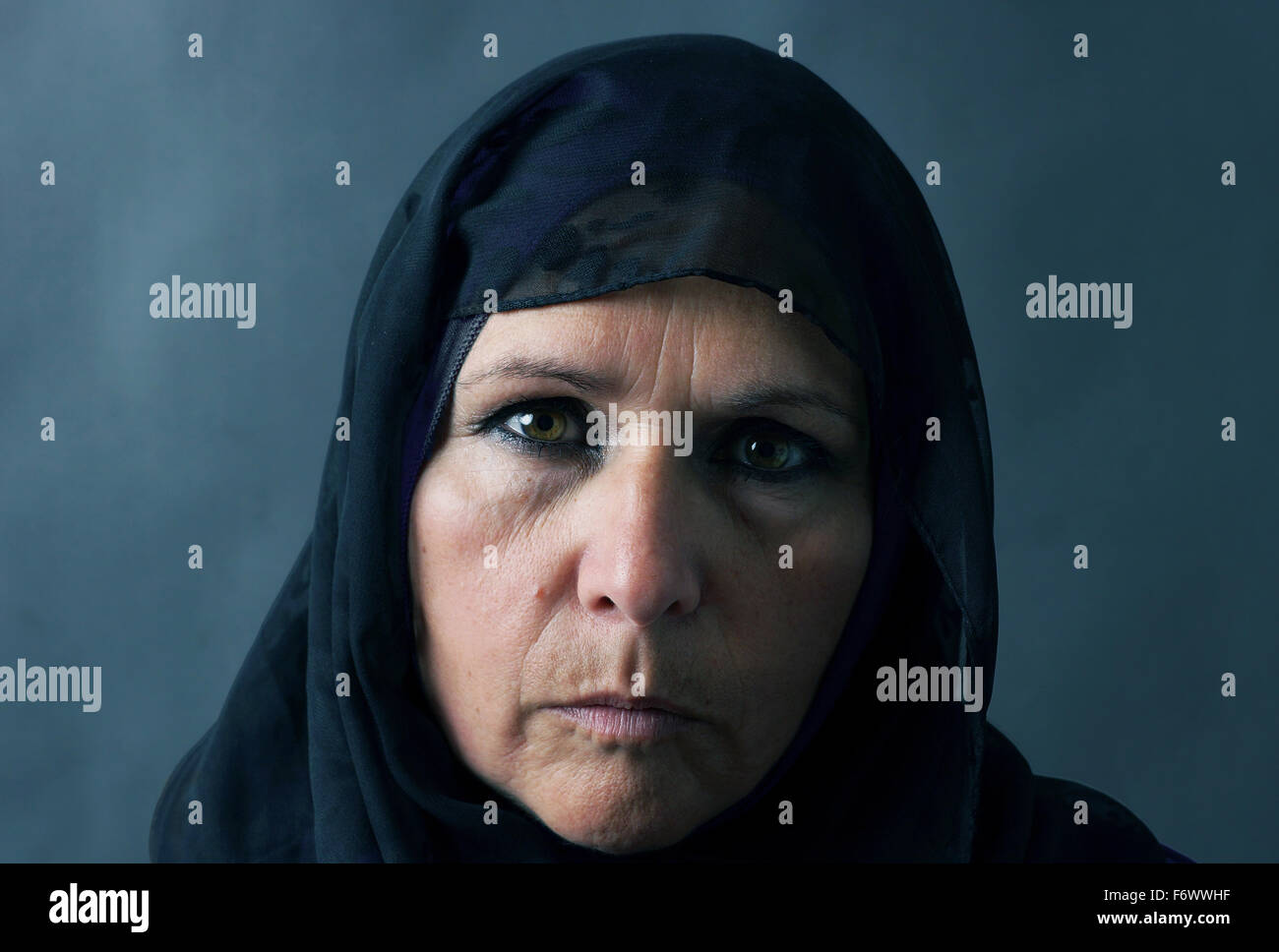 Dramatic sombre portrait of a muslim woman Stock Photo