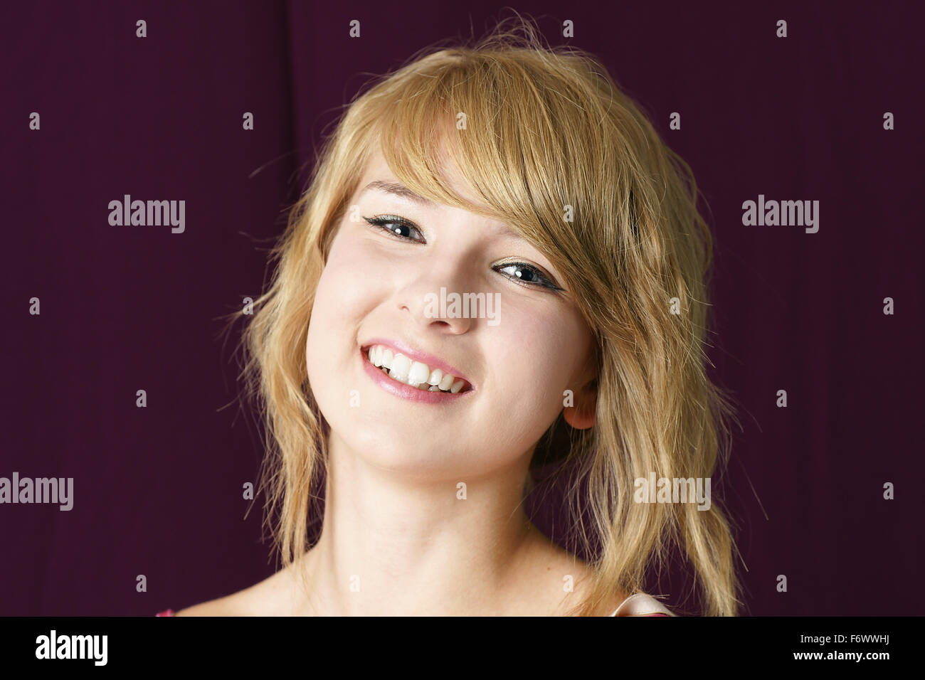 Portrait of a natural, young beautiful blond girl smiling Stock Photo ...
