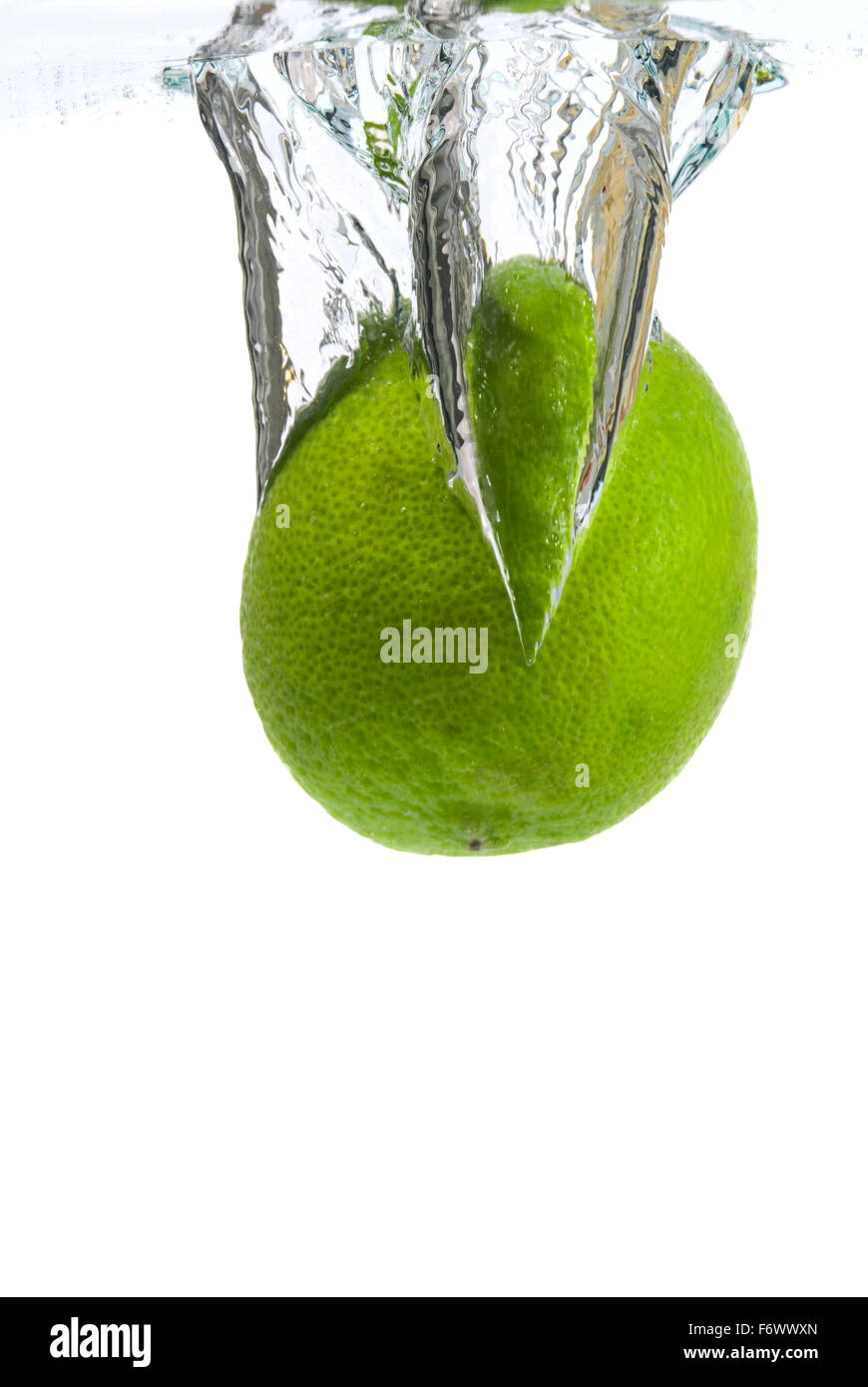Lime plunge into water Stock Photo