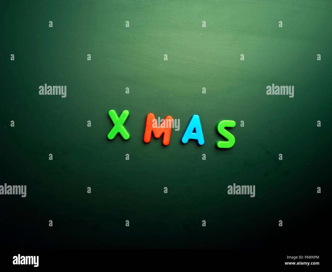 xmas concept in colorful letters isolated on blank blackboard Stock Photo