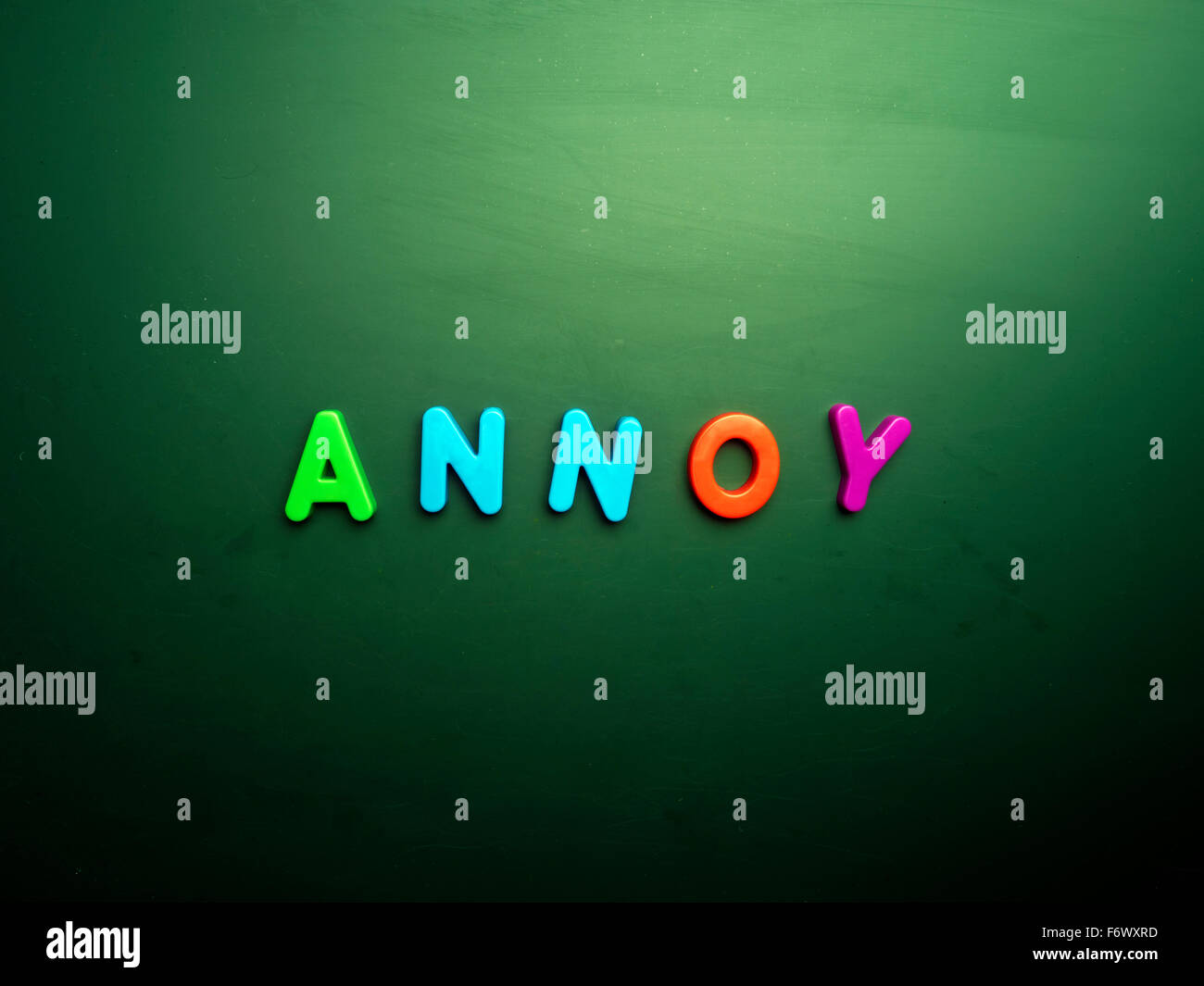 annoy concept in colorful letters isolated on blank blackboard Stock Photo