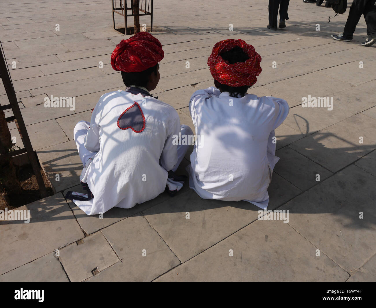 Two Mahouts sitting down resting at the Amer Fort/Amber Fort Jaipur. Stock Photo
