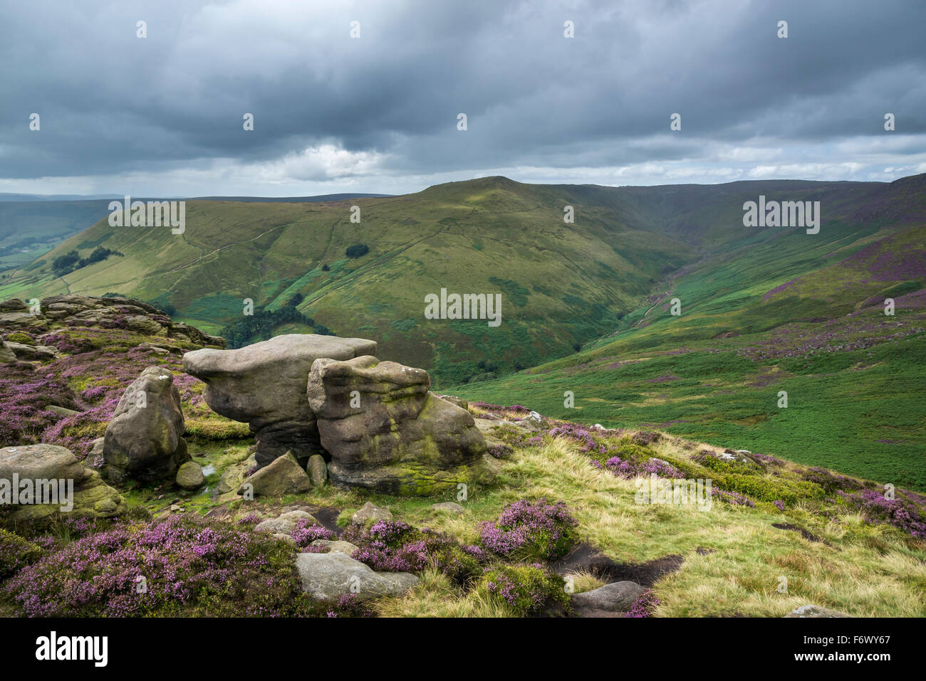 Changeable weather on the hills of the Peak District in Derbyshire. View from Ringing Roger near Edale. Rain falling on hills. Stock Photo