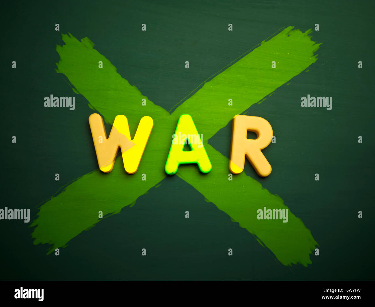 peace or anti war concept in colorful letters isolated on blank blackboard Stock Photo