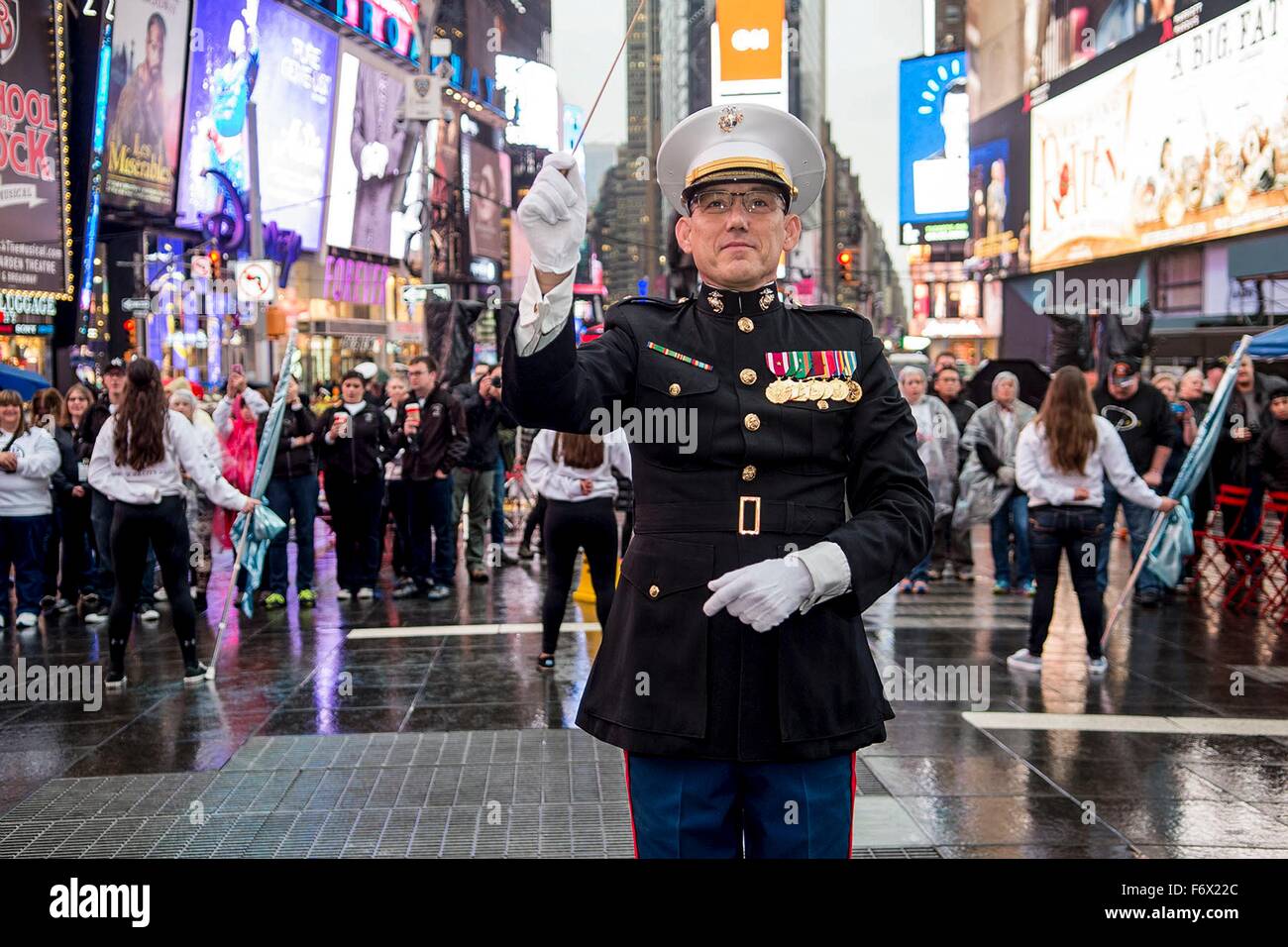 A U.S. Marine Corpsband director leads the Marine Corps Hymn to mark the Marine Corps birthday in Time Square during Veterans Week November 9, 2015 in New York City, NY. Stock Photo