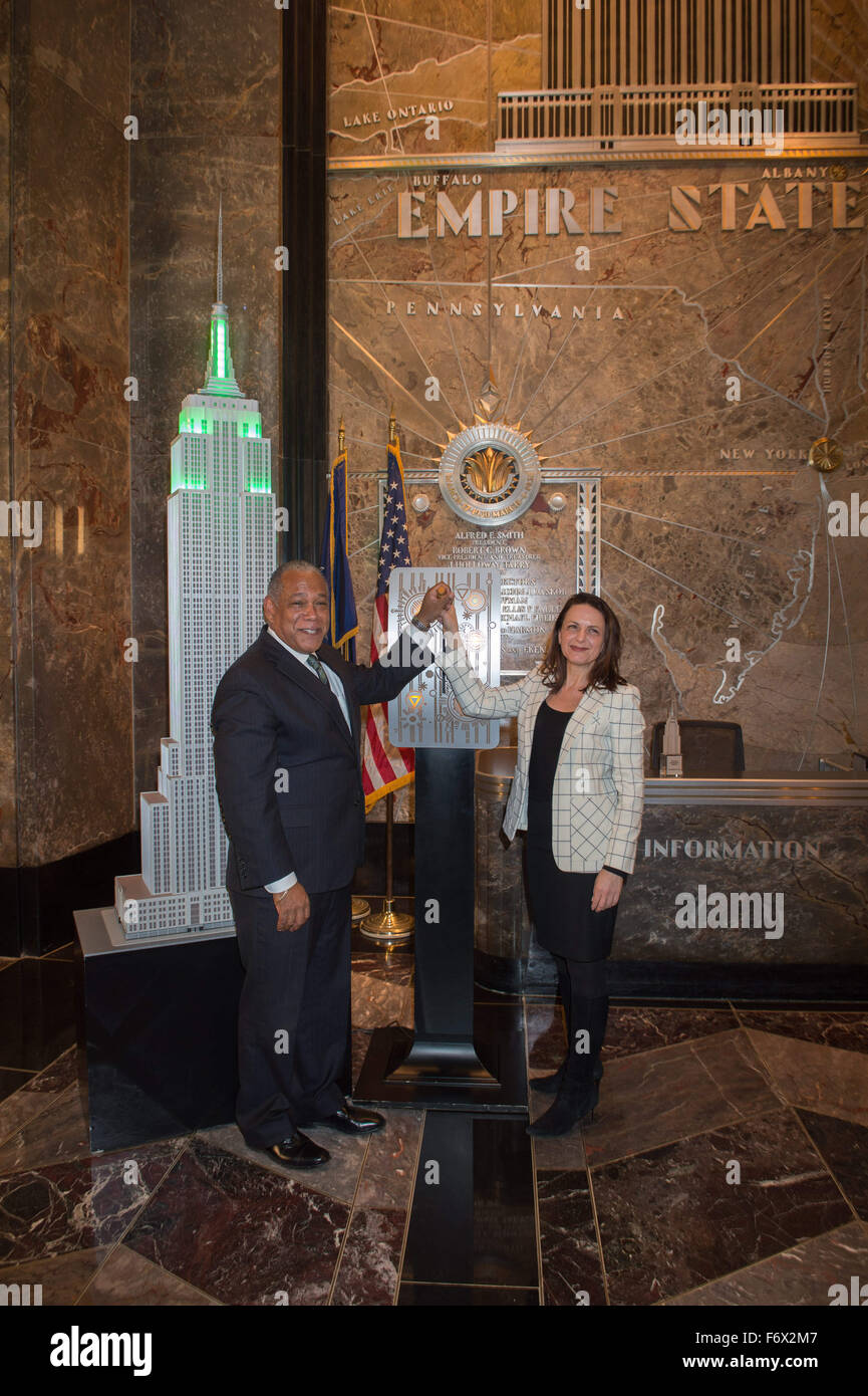 New York, NY, USA. 20th Nov, 2015. MITCHELL J. SILVER, FAICP, Commissioner, NYC Parks and DEBORAH MARTON, Executive Director, New York Restoration Project light the the Empire State Building to celebrate the millionth tree planted in New York City, Friday, Nov. 20, 2015. © Bryan Smith/ZUMA Wire/Alamy Live News Stock Photo