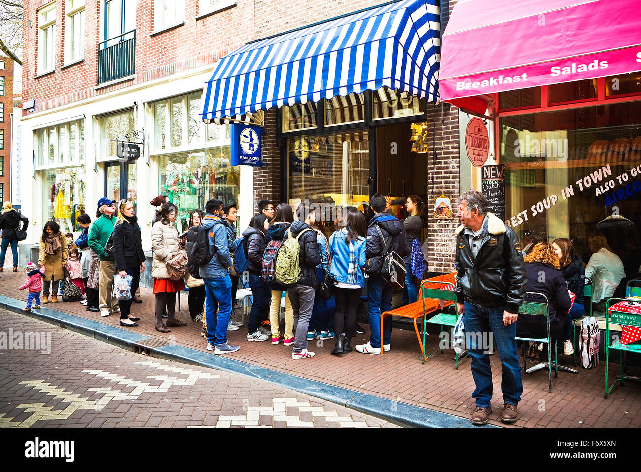 Queue of people outside of a pancake shop in Amsterdam Stock Photo