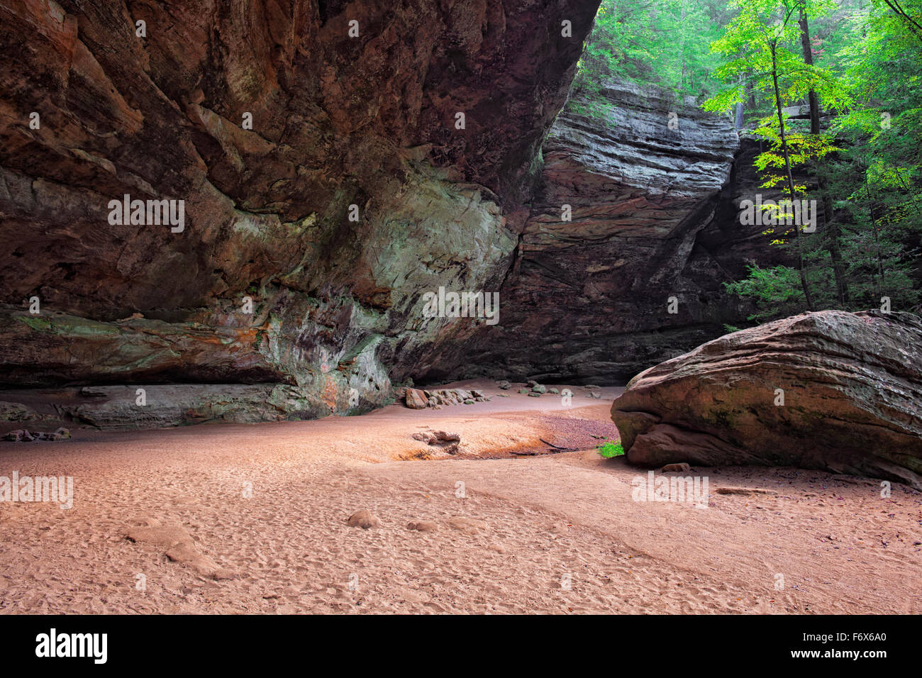 The largest cave in Ohio is Ash Cave with its large overhanging ledge in Hocking Hills State Park. Stock Photo
