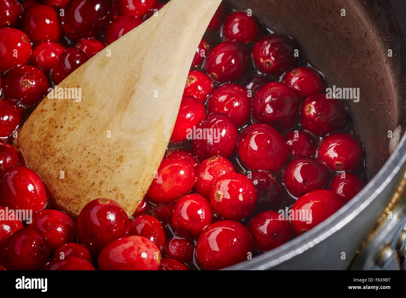 Whole cranberry sauce cooking Stock Photo