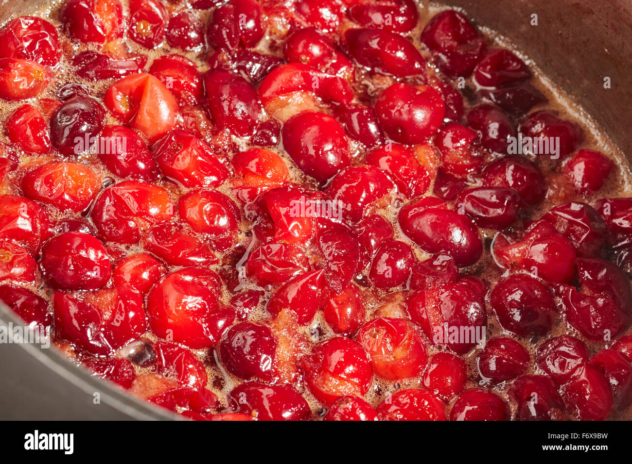 Whole cranberry sauce cooking Stock Photo