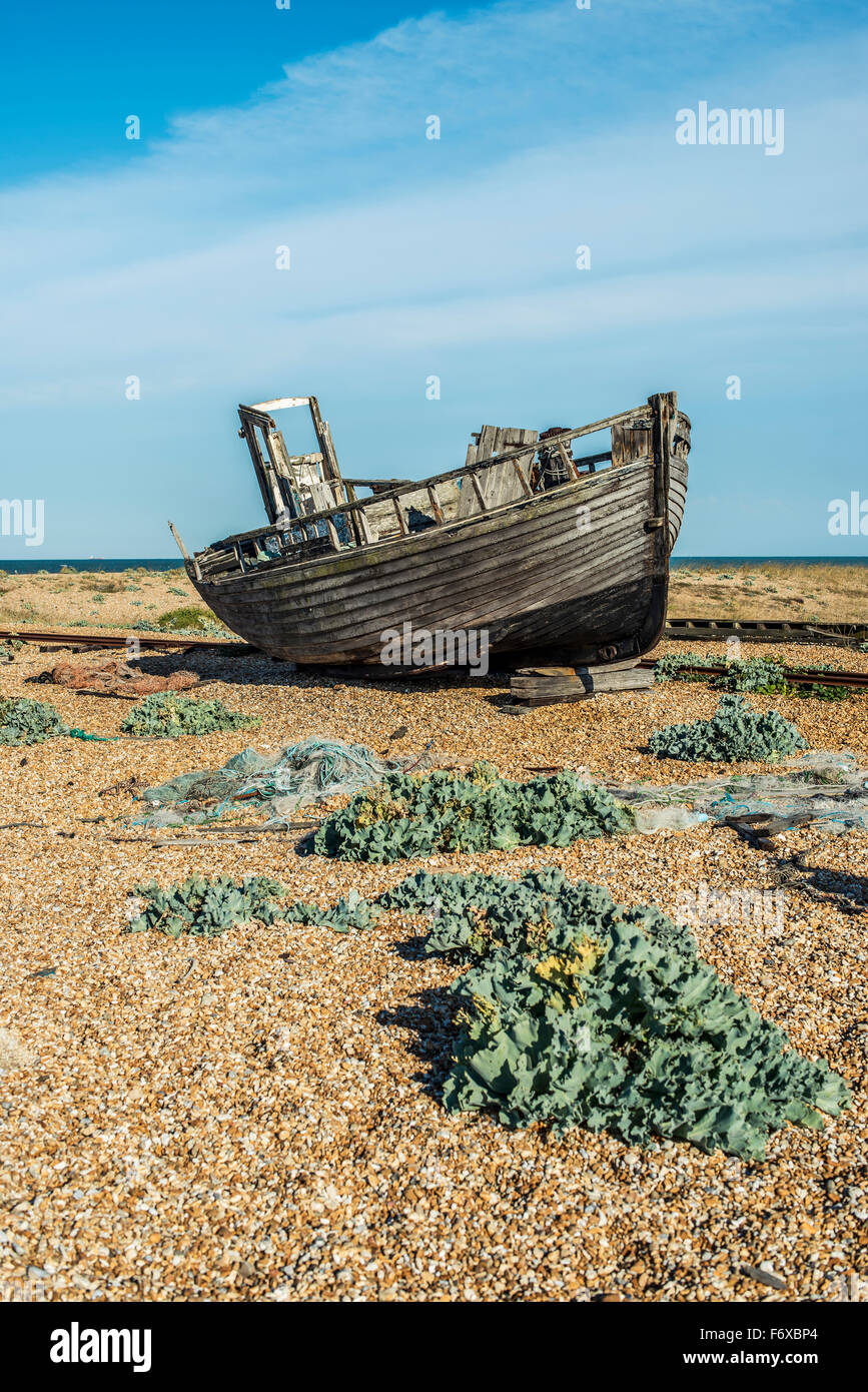 Old boat on Dungeness shingle beach; Dungeness, Kent, England Stock Photo