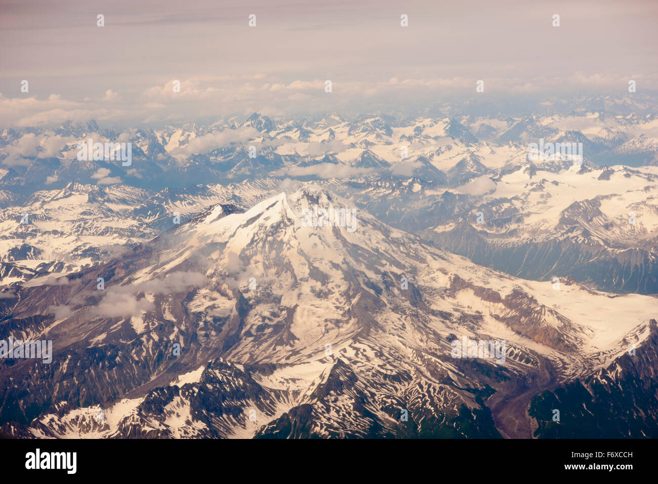 Aerial view of snow-covered Mt. Iliamna and surrounding mountains of the Aleutian Range, Alaska Peninsula, Southwestern Alaska, USA, Summer Stock Photo