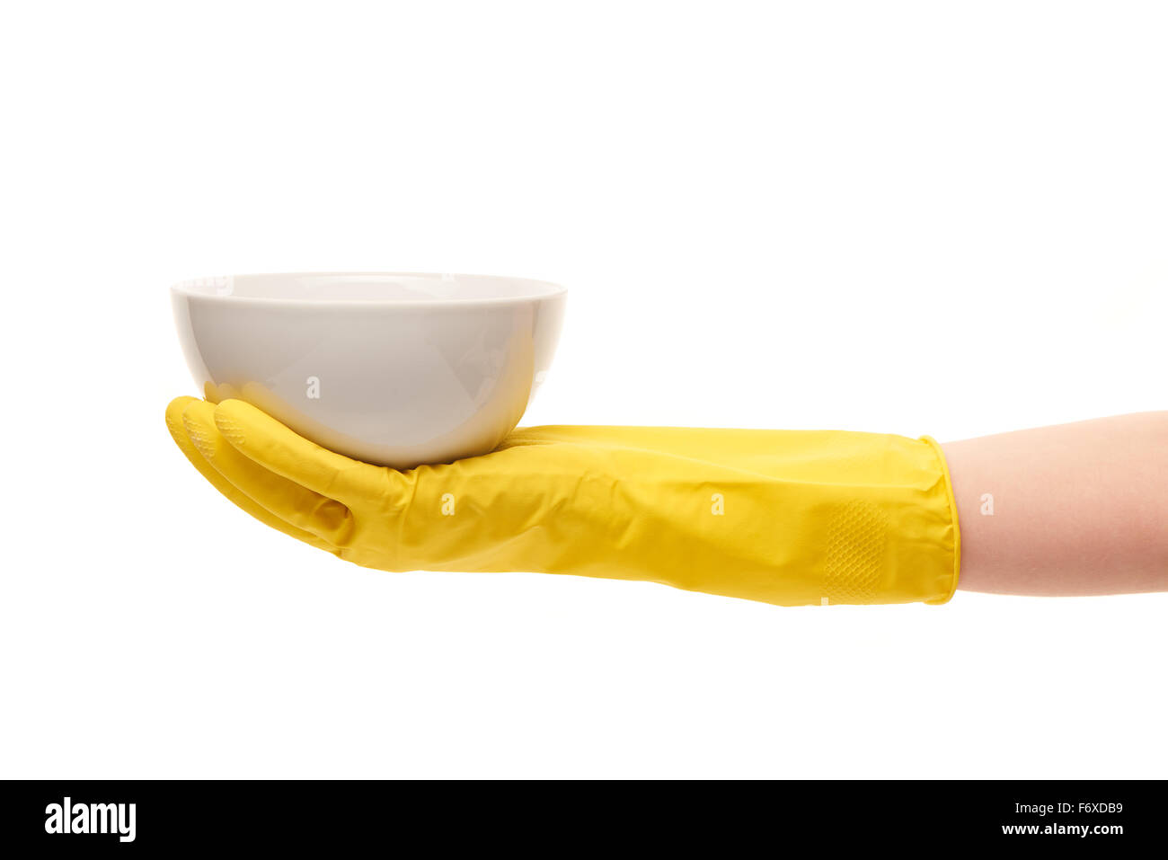 Close up of female hand in yellow protective rubber glove holding clean ...