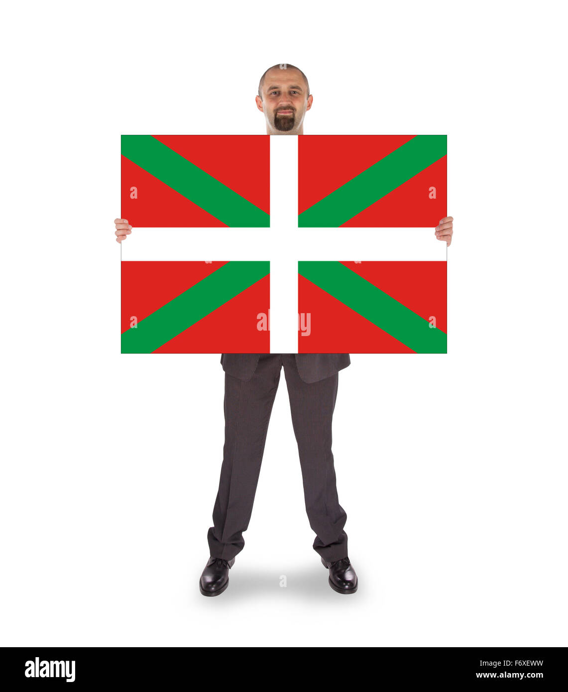 Smiling businessman holding a big card, flag of Basque Country