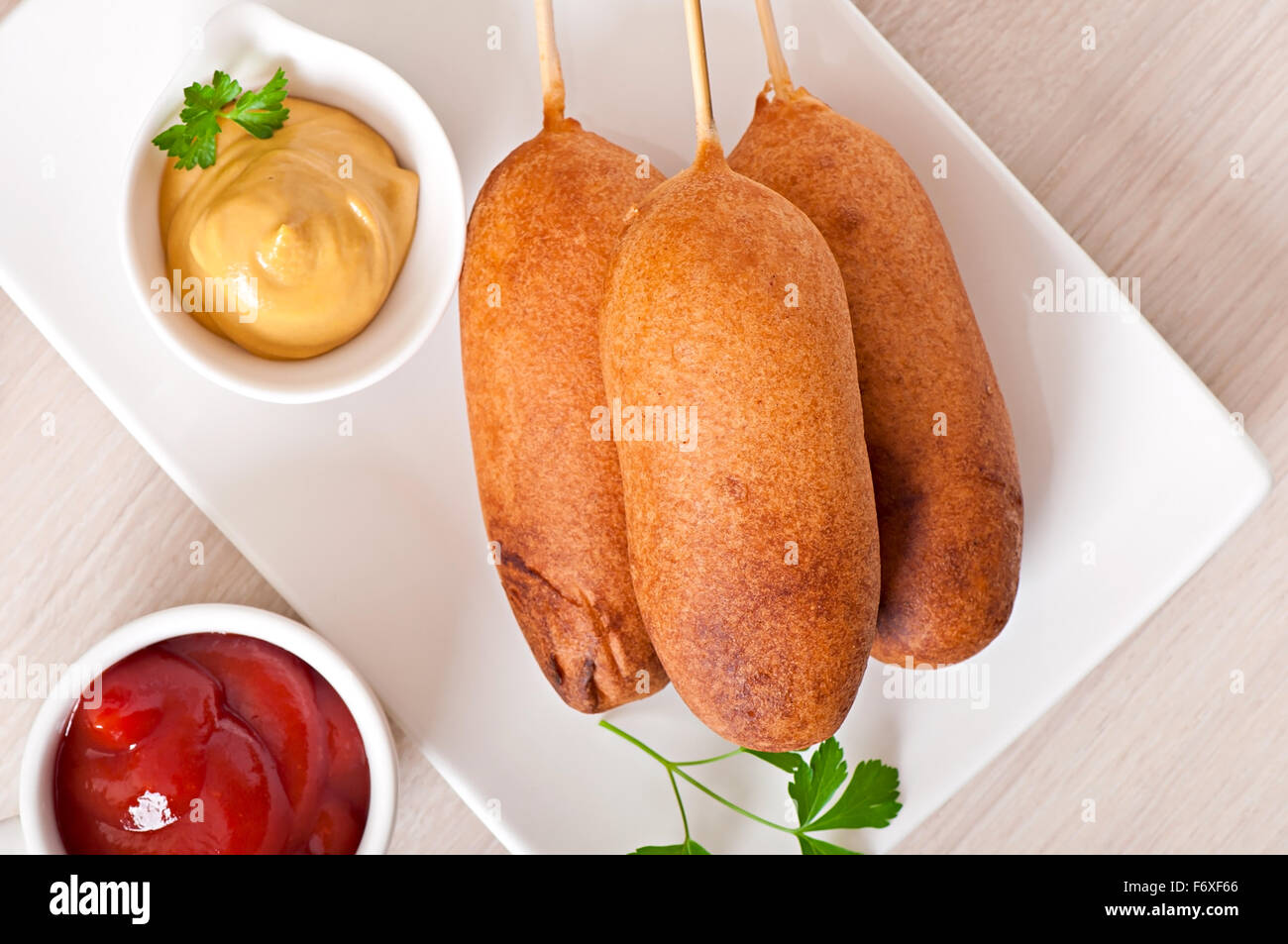 Homemade corn dogs with sauces Stock Photo
