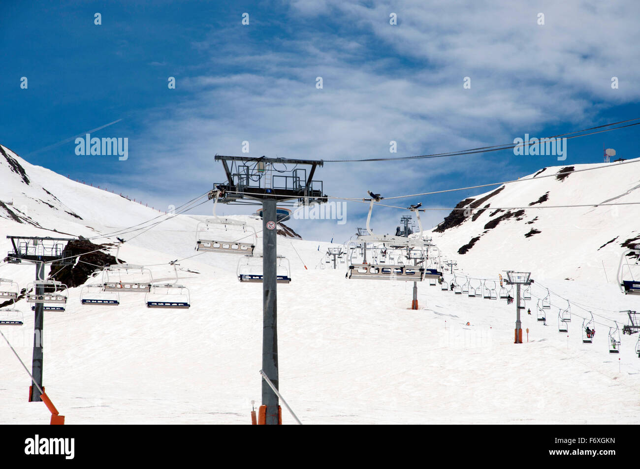 Chair lift in snowed Mountains in the Pyrenees, and ski slopes in Pas de la Casa, Andorra. Stock Photo