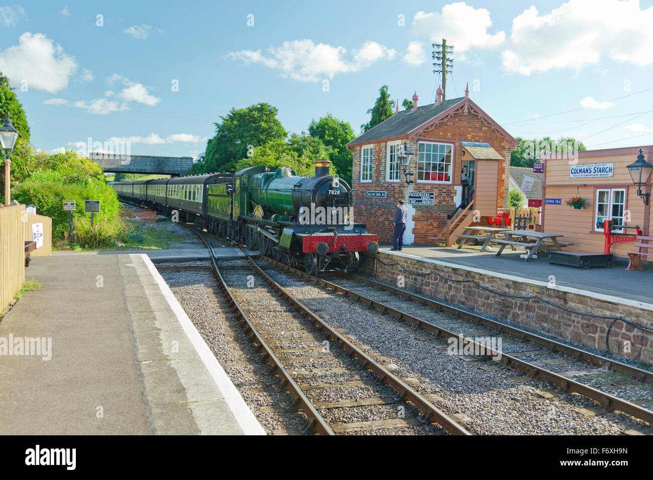 Ex GWR steam loco 7828 'Odney Manor' arriving at Williton with a train for Minehead on the West Somerset Railway, England, UK Stock Photo