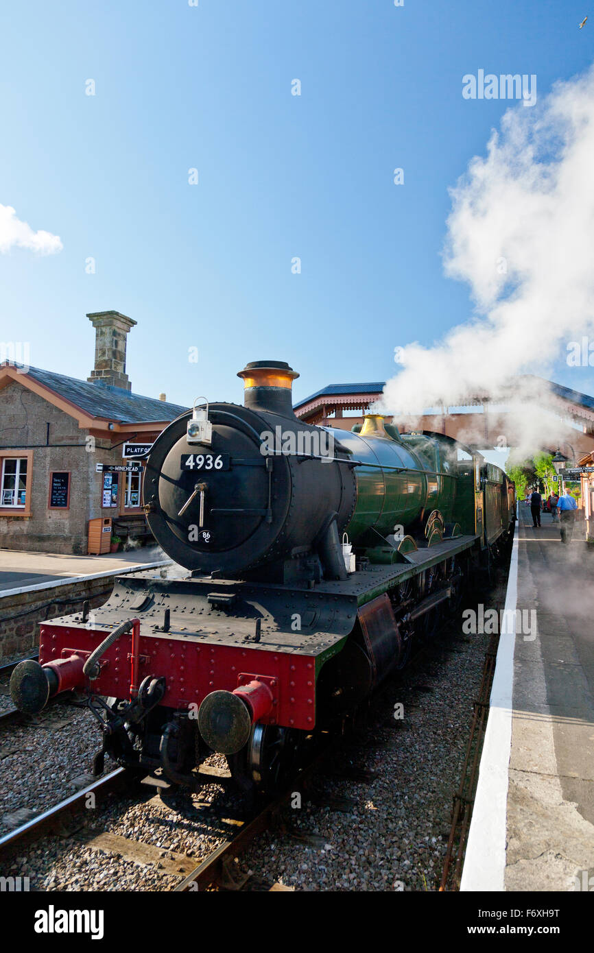 Ex GWR steam loco 4936 'Kinlet Hall' leaves Williton with a train for