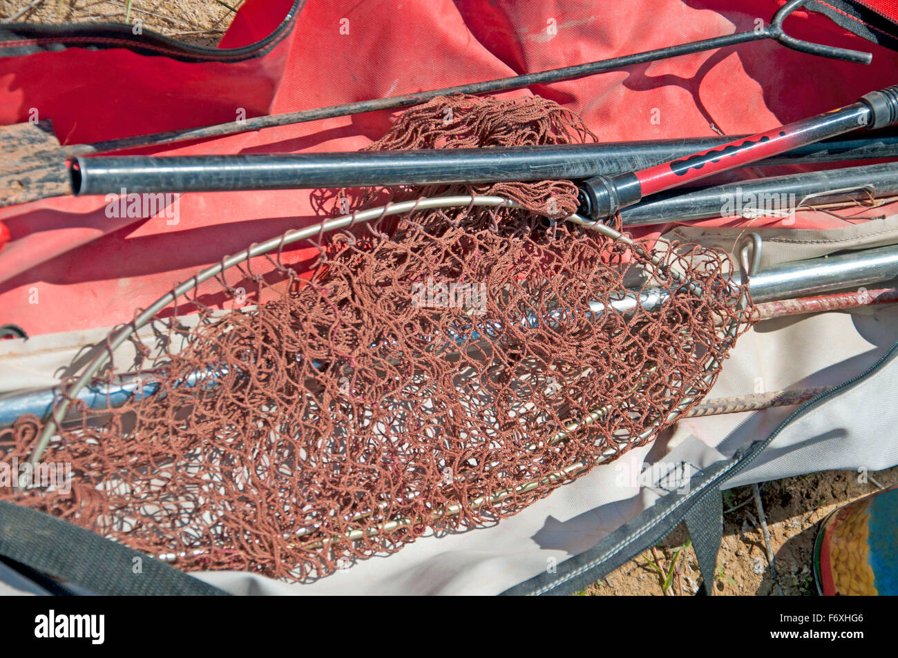 Set of fishing tools, such a net and a rod Stock Photo
