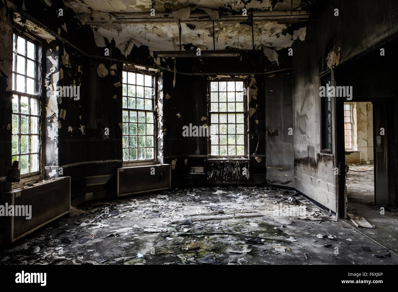 inside view of a deserted run down building after a fire Stock Photo ...