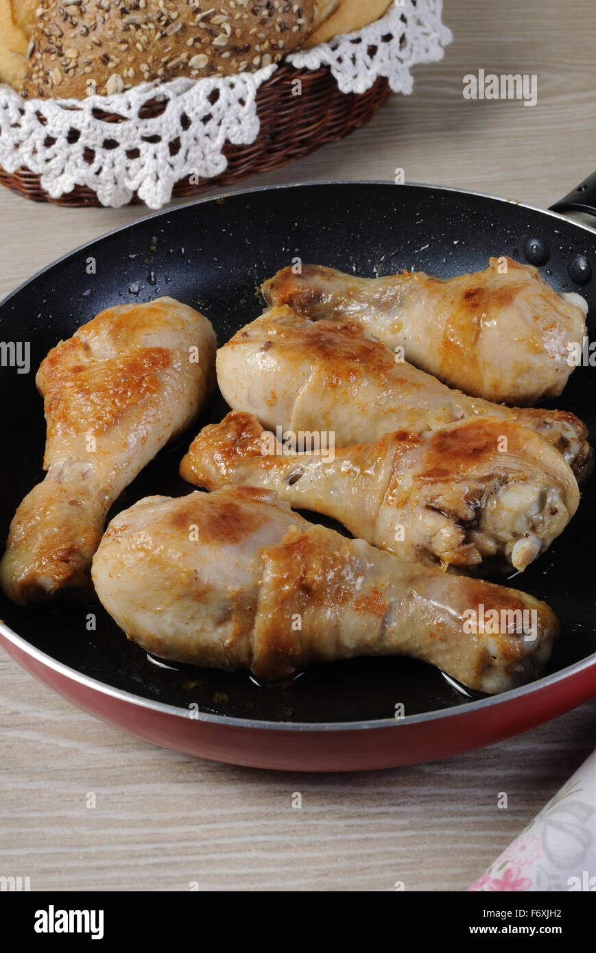 Ruddy fried chicken drumsticks in a pan Stock Photo Alamy