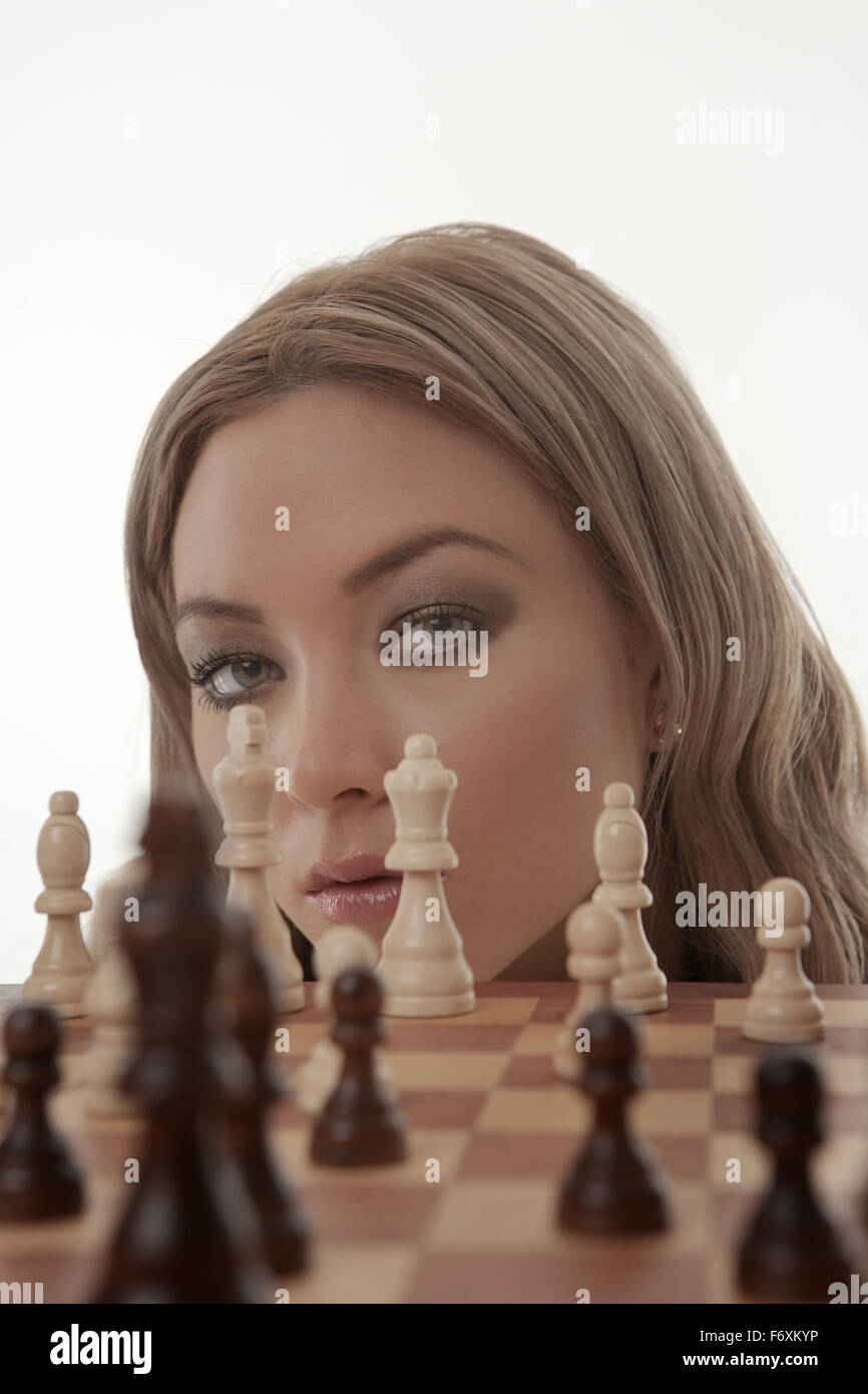 Image of a businesswoman playing chess shot in the studio Stock Photo