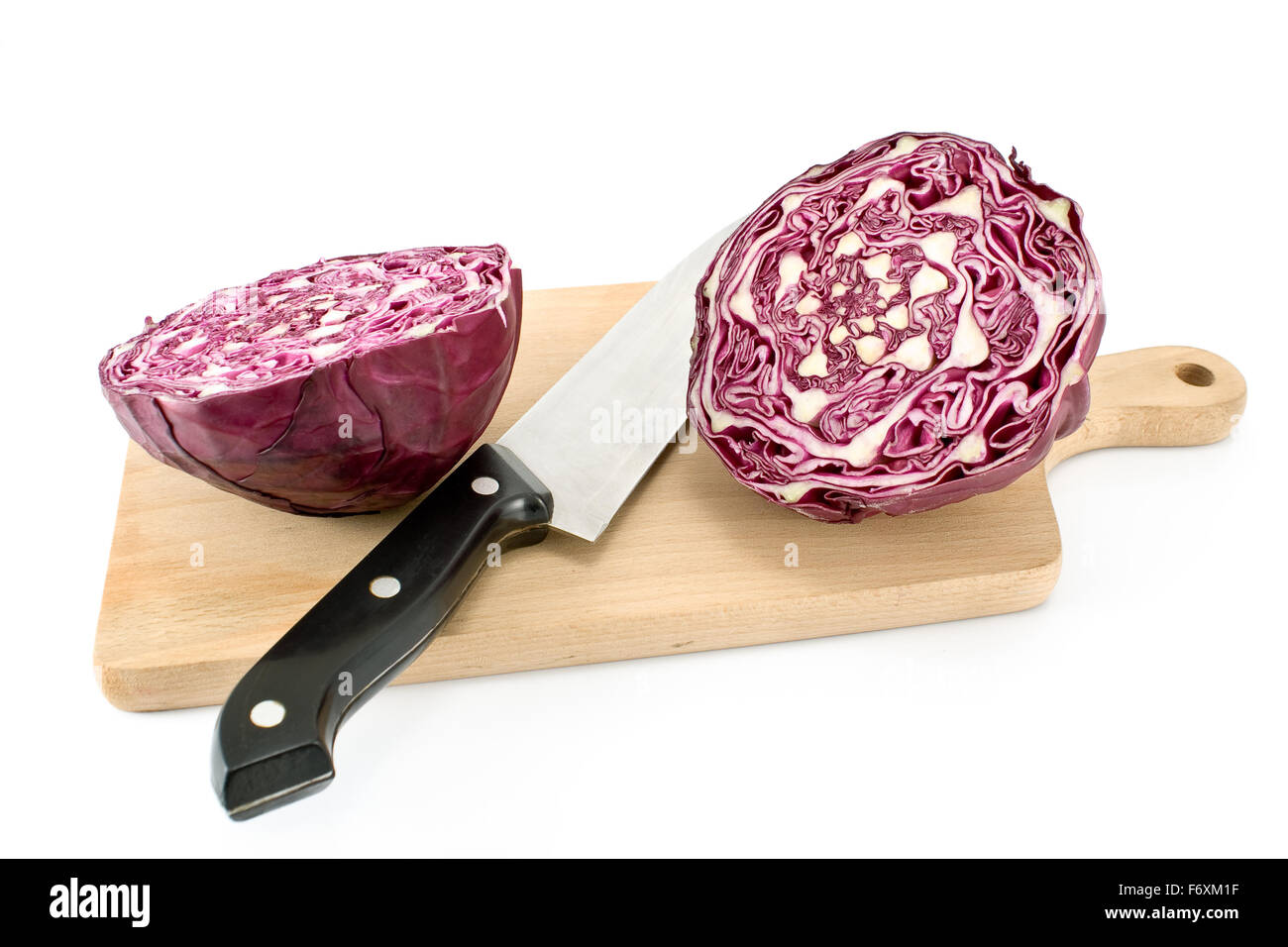 Red cabbage with knife and cutting board isolated on white Stock Photo