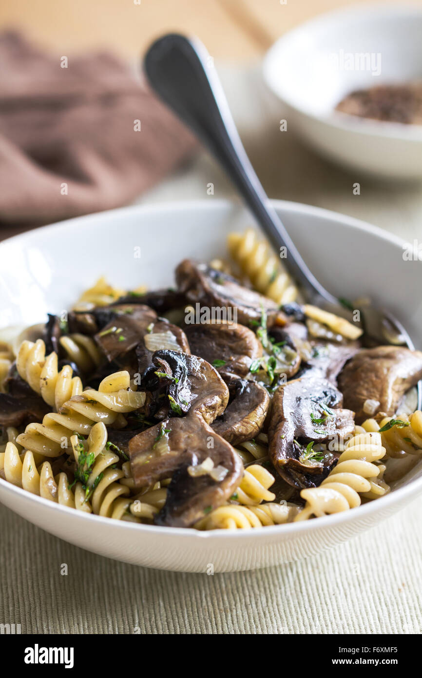 Fusilli with mushroom and herb sauce in a bowl Stock Photo