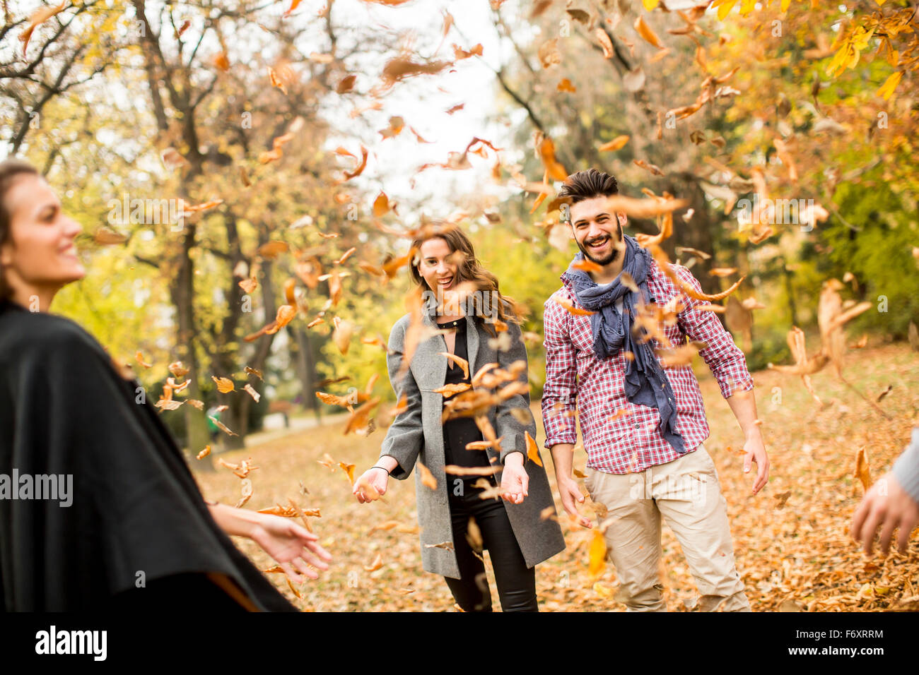 Have Fun Fall!!!!! Young people having fun in the autumn park Stock Photo - Alamy
