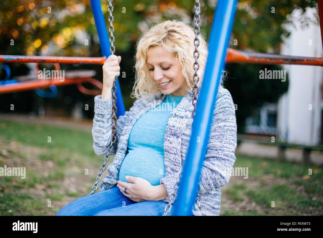 Pregnant woman on the swing Stock Photo Alamy