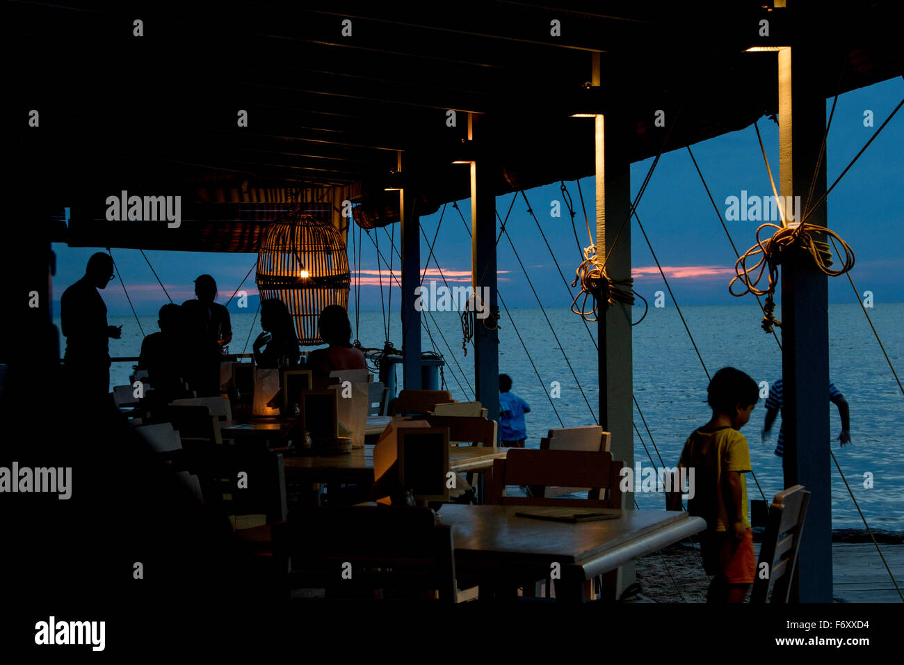 Kep yacht club restaurant scene jetty dusk sunset Stock Photo