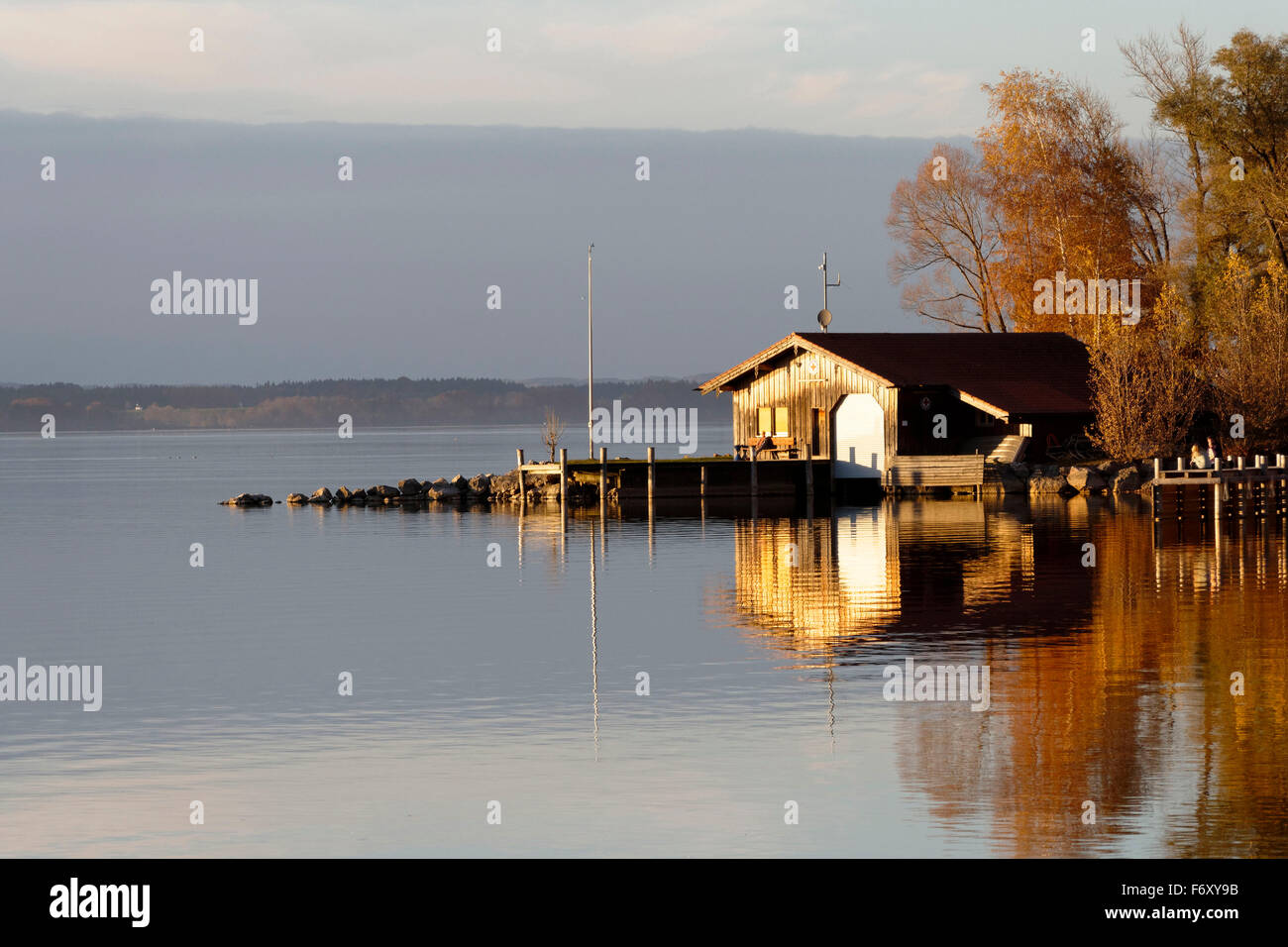 Shoreline view to the Wasserwacht ( life guard ) station boat shed, Feldwieser  Bay, Chiemsee, Upper Bavaria, Germany, Europe. Stock Photo