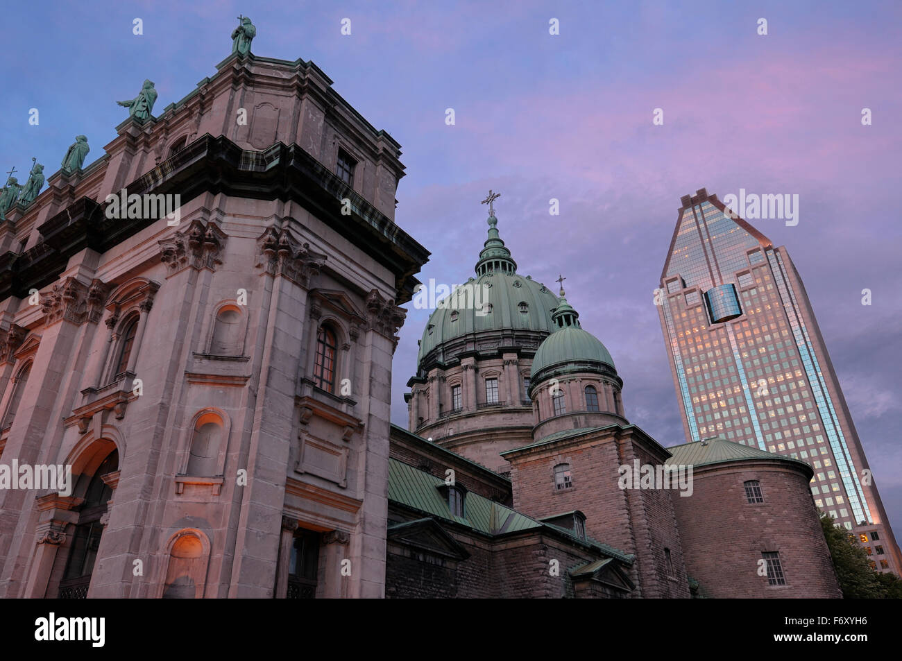 Highrise with Green dome and facade of Mary Queen of the World Basilica Montreal Stock Photo