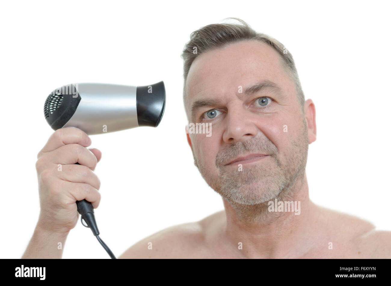 Unshaven Middle Aged Man Blow Drying His Short Hair With A
