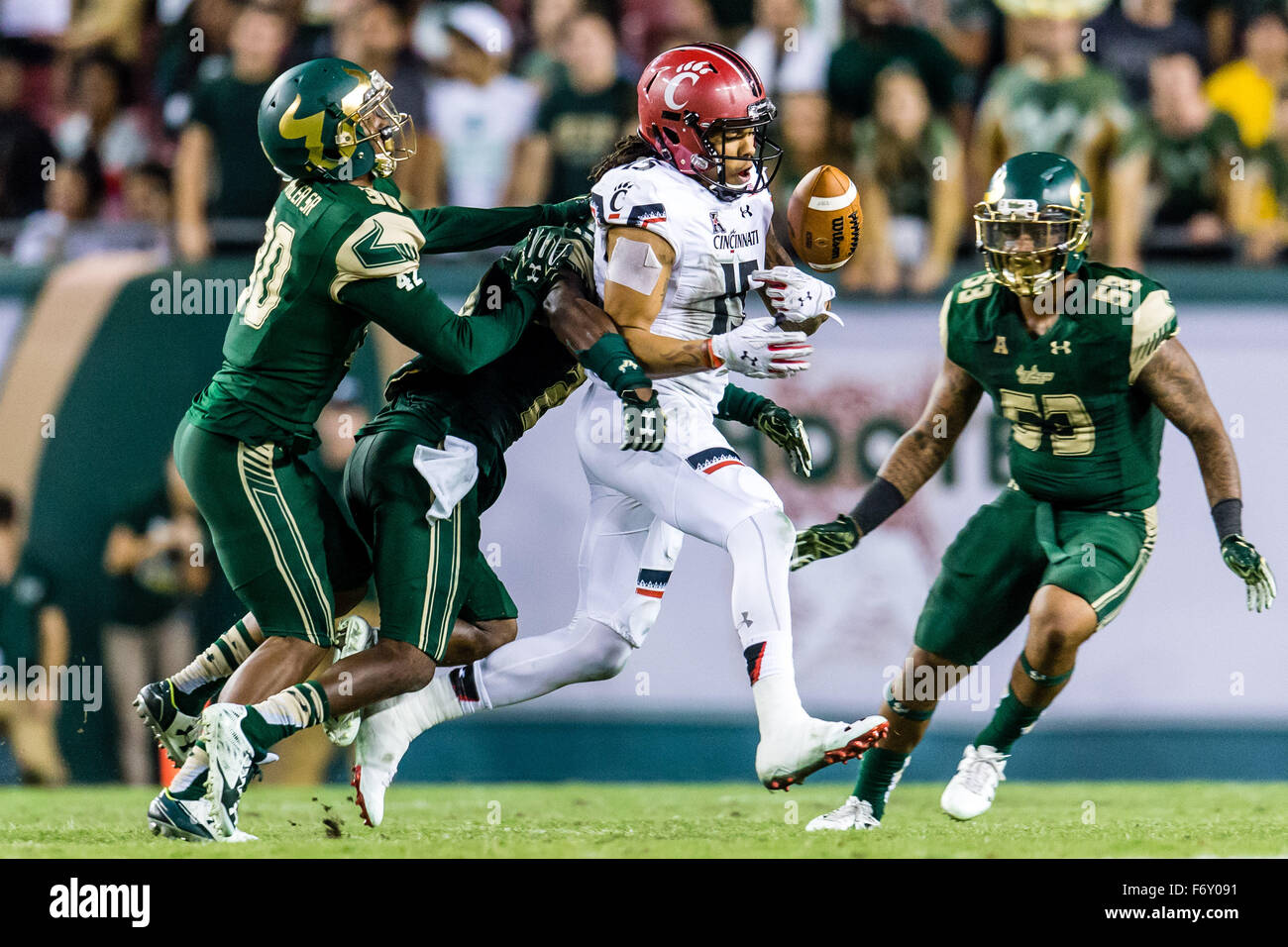 November 20, 2015: South Florida Bulls cornerback Devin Abraham #20 hits Cincinnati Bearcats wide receiver Chris Moore #15 after the catch and knocks it loose in the 4th quarter in the game between the Cincinnati Bearcats and the South Florida Bulls at Raymond James Stadium in Tampa, FL Credit Image: Del Mecum CSM Stock Photo