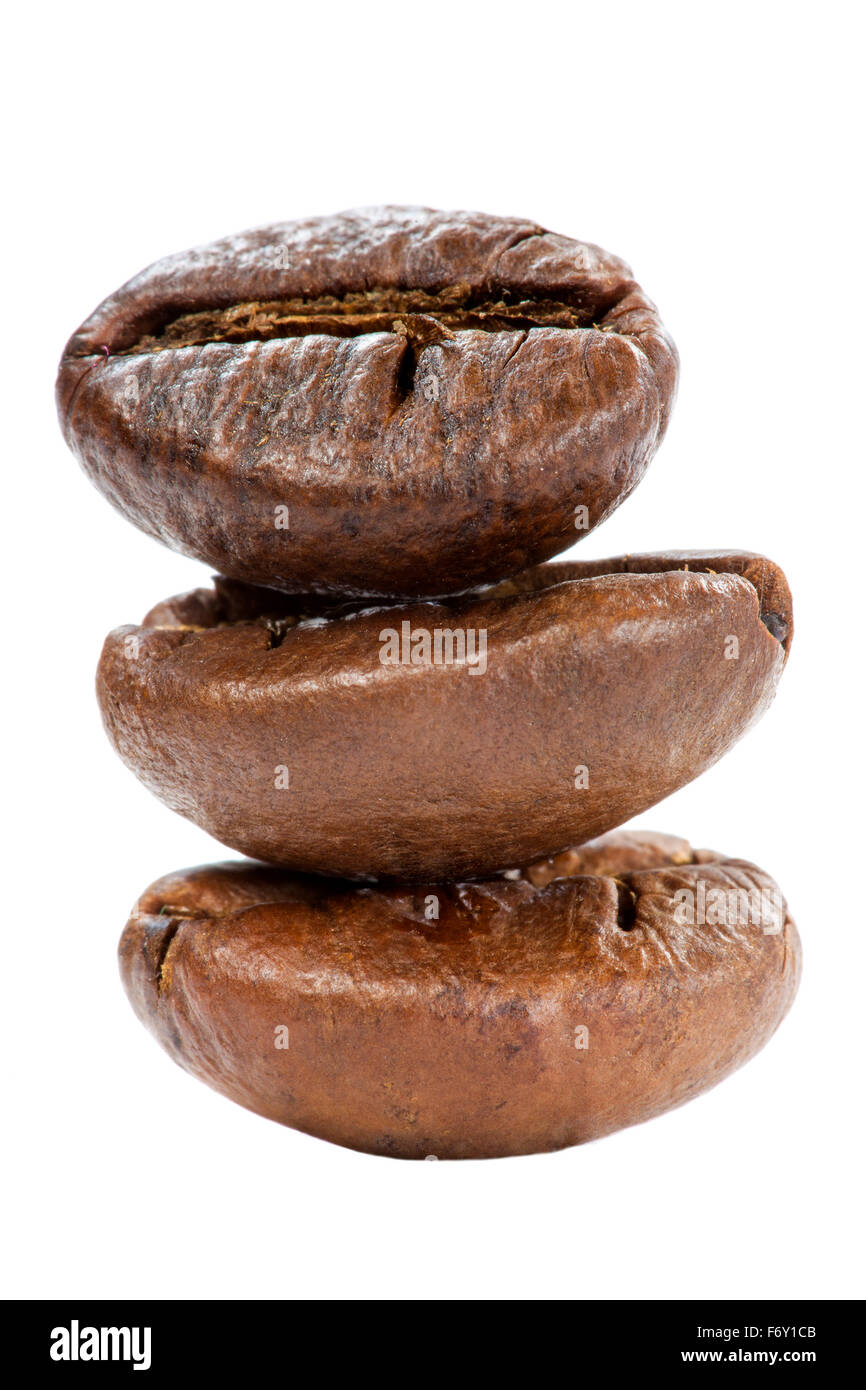 Three coffee beans stacked and isolated on a white background Stock Photo